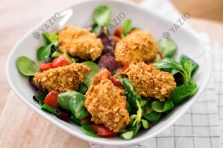 Crispy Chicken Nuggets on Salad